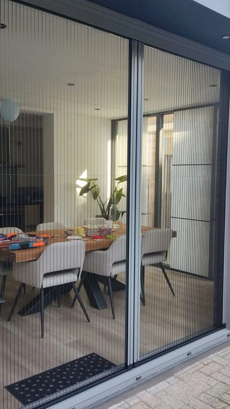Thermal break aluminium window with zigzag fly mesh installed in modern Islamabad home